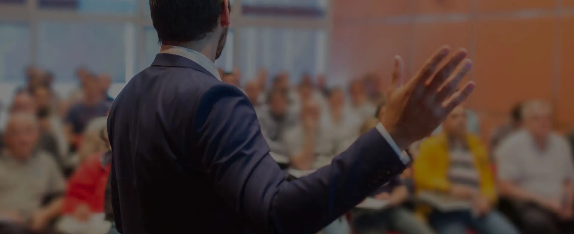 Man speaking to an audience